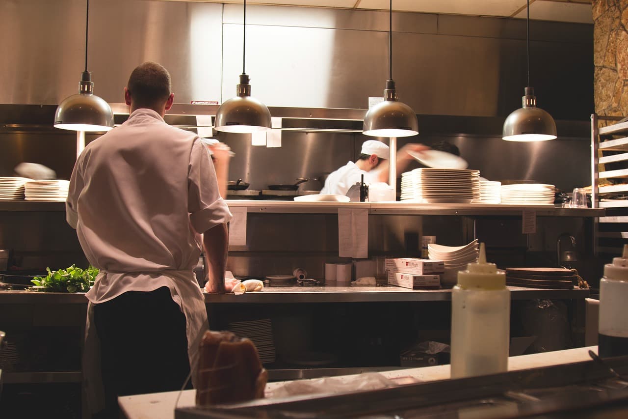 Chefs at work in a busy commercial kitchen